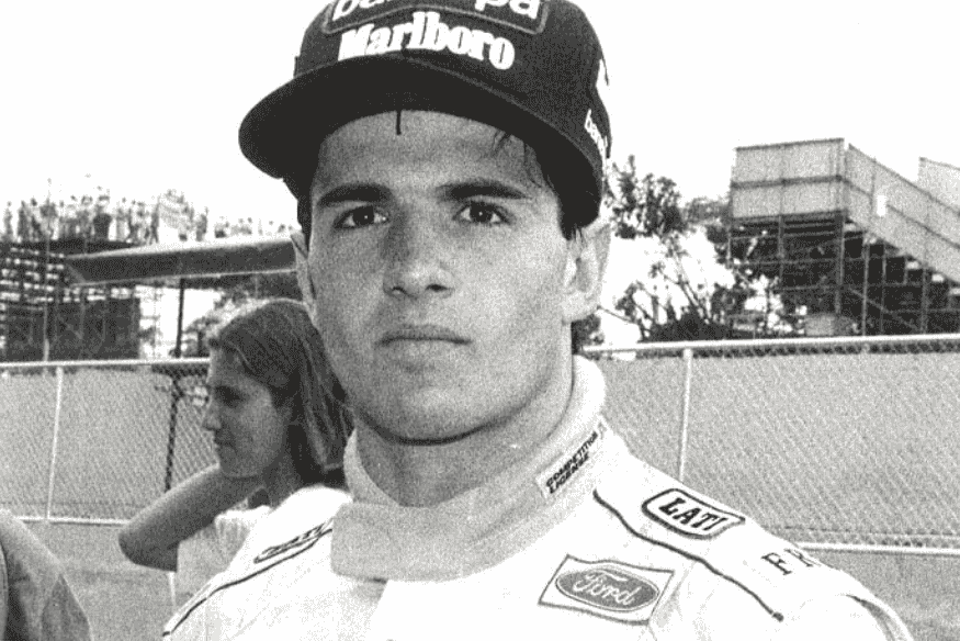 Christian Fittipaldi, jovem piloto brasileiro com boné e uniforme de corrida nos anos 90